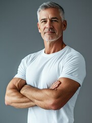 fit middle-aged man in tank top standing with hands on hips