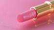 © Phannaporn - Pink lipstick tube, lip gloss top view. Beauty industry concept.