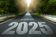 © Pcess609 - Starting 2025 Goal plan action, Business target and growth strategy. New year resolution and challenge. 2025 written on the road in the middle of an asphalt road with Goal plan action. way to success