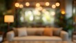 © Andrei - Blurred Living Room with Sofa, Pillows, and Warm Lighting, Cozy Home Interior Background