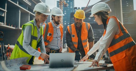 Diverse Multiethnic Team of Construction Workers Having a Meeting Outdoors at a Building Site. Male and Female Infrastructure Company Crew Discussing Office Building Development Plans