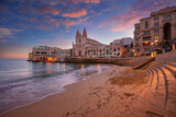 St. Julian's, Malta. Cityscape image of seaside town St. Julian's, Malta at beautiful sunrise.
