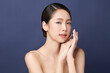 © kitthanes  - Beautiful young asian woman with clean fresh skin on blue background, Face care, Facial treatment, Cosmetology, beauty and spa, Asian women portrait.