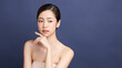 © kitthanes  - Beautiful young asian woman with clean fresh skin on blue background, Face care, Facial treatment, Cosmetology, beauty and spa, Asian women portrait.