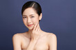 © kitthanes  - Beautiful young asian woman with clean fresh skin on blue background, Face care, Facial treatment, Cosmetology, beauty and spa, Asian women portrait.