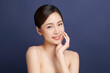 © kitthanes  - Beautiful young asian woman with clean fresh skin on blue background, Face care, Facial treatment, Cosmetology, beauty and spa, Asian women portrait.