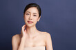 © kitthanes  - Beautiful young asian woman with clean fresh skin on blue background, Face care, Facial treatment, Cosmetology, beauty and spa, Asian women portrait.