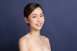 © kitthanes  - Beautiful young asian woman with clean fresh skin on blue background, Face care, Facial treatment, Cosmetology, beauty and spa, Asian women portrait.