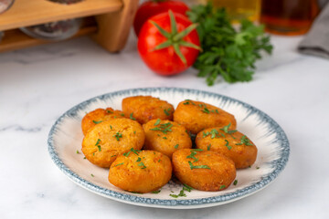 Wall Mural - A plate of delicious fried potato patties (Turkish name; patates koftesi)