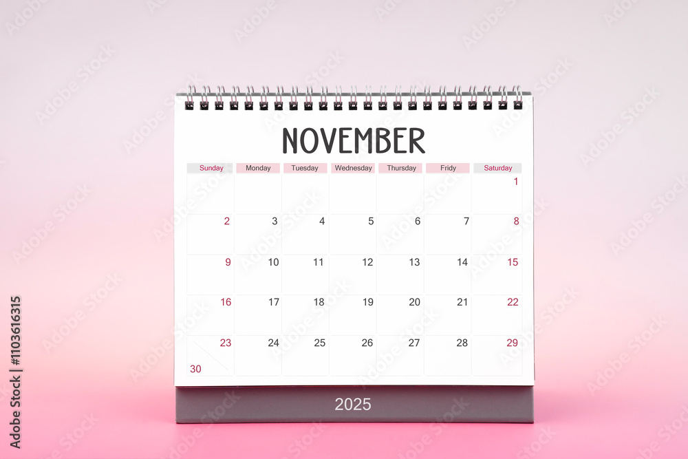 Desktop monthly calendar for November 2025 on pink background. Stock ...