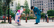 © peopleimages.com - Respect, japanese people and bow for greeting, culture and welcome with kimono in city. Traditional fashion, man and woman with introduction in urban town for honor, departure and farewell custom