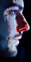 Wall Mural - Profile of man using facial recognition, face illuminated by screen, close-up