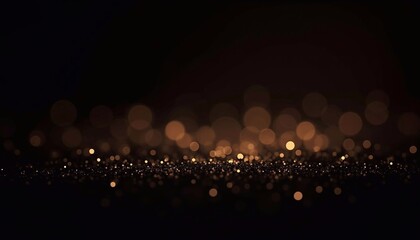 Luxurious golden sparkles on a black background with bokeh effect, festive background, wallpaper, banner