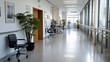 © rashyn - Modern hospital corridor with chairs, plants, and large windows.