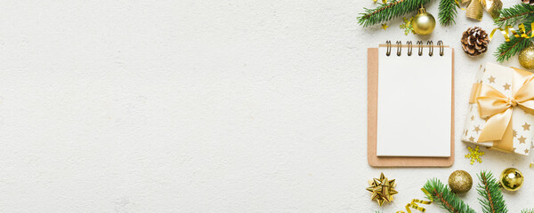 Wall Mural - Christmas blank greeting card mock-up scene. Creative layout made of Christmas tree branches and paper card note. Flat lay. Nature New Year concept