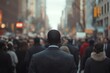 © Imagentive - Back View Anonymous Man in Suit Walking Busy City Crowd