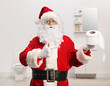© Ljupco Smokovski - Santa claus in a bathroom holding a toilet paper