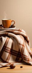Wall Mural - A warm autumn scene featuring a cozy cashmere blanket with plaid, coffee, maple leaves, and acorns in front of a soft beige background.