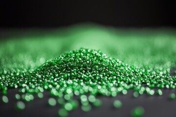 Poster - Close-up View of Shimmering Green Granules on Black Surface Ideal for Artistic Backgrounds, Abstract Textures, Craft Projects, and More