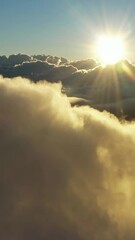 Wall Mural - flying above the clouds. aerial view of clouds and morning sun. traveling by air perfect background.