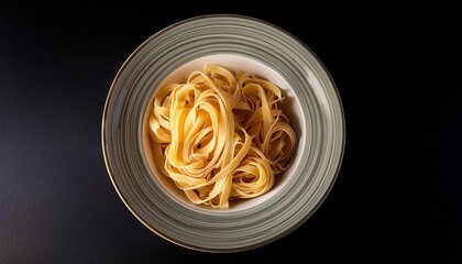 Canvas Print - Plate of spaghetti on a black background top view