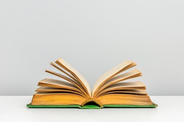 Aufkleber - A minimalist depiction of an open old book with pages curling, surrounded by subtle shading on a white canvas