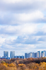 Wall Mural - cloudy sky over colorful city park and district