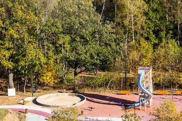 Wall Mural - above view of playground in city park in autumn