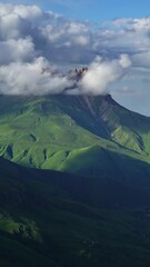 Wall Mural - beautiful landscape with mountains and clouds in dusk, caucasus, russia, timelapse. vertical video