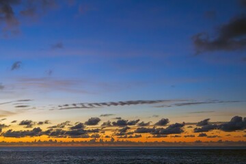 Wall Mural - golden sunset sky over the atlantic ocean, tenerife. empty landscape with dramatic clouds and bright