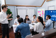 © InfiniteFlow - Analyst team utilizing BI Fintech to analyze financial data at table in meeting room. Businesspeople analyzing BI dashboard power for business insight and strategic marketing planning. Prudent