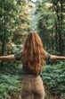 © Alexandr Efimov - A woman standing in a forest, arms outstretched, looking into the distance.