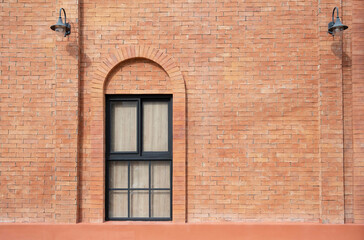 Wall Mural - Orange brick wall decorated with arched frame and mirror window inside.