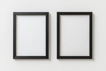 Two black framed pictures are hanging on a white wall