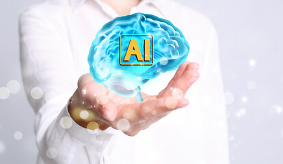 Poster - Artificial intelligence. Woman holding virtual brain with AI abbreviation on white background, closeup. Banner design