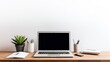 © Mandeep - minimalist workspace with laptop and office supplies