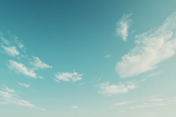 clear blue sky with soft clouds