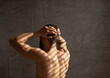 © Prostock-studio - Back Rear View Of Adult Muscular Man Taking Shower Washing Head Standing Under Falling Hot Water In Modern Bathroom At Home. Male Bodycare Beauty Routine And Everyday Hygiene Concept