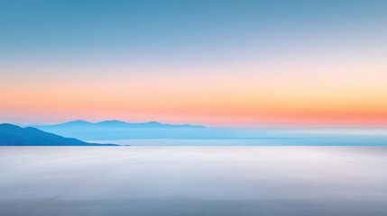 Wall Mural - Serene sunset over distant mountains and horizon