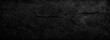 Dark Black Textured Abstract Background with Cracked Rock Surface and Copy Space for Design