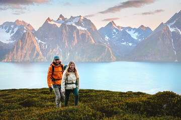 Wall Mural - couple friends trekking in norway man and woman traveling together, active vacations healthy lifesty