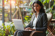 © PIX OF WORLD AI - business model woman using laptop sitting in chair in sunny office.