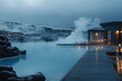 © Vovmar - Blue Lagoon, a luxury hot spring resort with steaming waters and surrounded by black rock formations. Generated by artificial intelligence