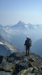 © Minh Do - Hiker standing on mountain peak with backpack