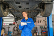 © kelvn - Female Auto mechanic are checking and repair maintenance auto engine is problems at car repair shop.