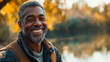© standret - Smiling mature man enjoying a peaceful day outdoors by a lake