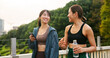 © EinFrame24/peopleimages.com - Fitness, happy friends and girls walking at park, talking or communication on phone. Japanese women, sports and outdoor together for body health conversation, exercise or gossip on break with bottle
