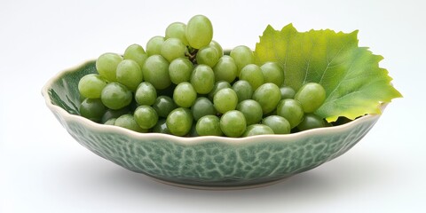 Poster - Fresh green grapes arranged beautifully in a bowl, accented by a vibrant leaf. This image captures the essence of green grapes, showcasing their natural appeal and freshness.