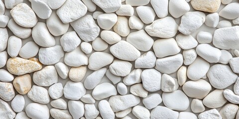 Aufkleber - Numerous white stones scattered on the floor create a unique texture. This image featuring white stones serves as an ideal background for various design purposes and creative projects.