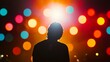 © TawaUStock - A public speaker on stage with colorful background lights in motion, intense spotlight focused on their face, conveying confidence and authority, the mood is charged with excitement, dramatic